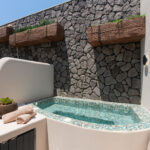 Suite 105 private terrace and outdoor hot tub at The Cosmopolitan Karterados Urban Suites